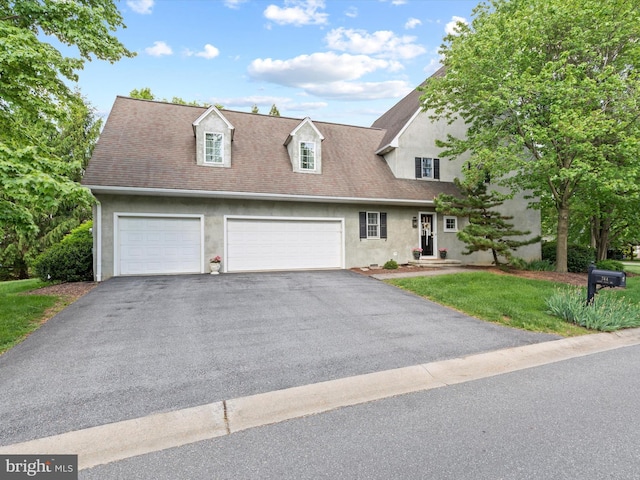 744 Goose Neck Dr, Lititz, PA 17543 - view of front facade featuring stucco siding, asphalt driveway, a garage, and a front lawn