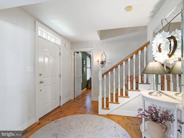 744 Goose Neck Dr, Lititz, PA 17543 - foyer entrance featuring wood-type flooring, baseboards, and stairs