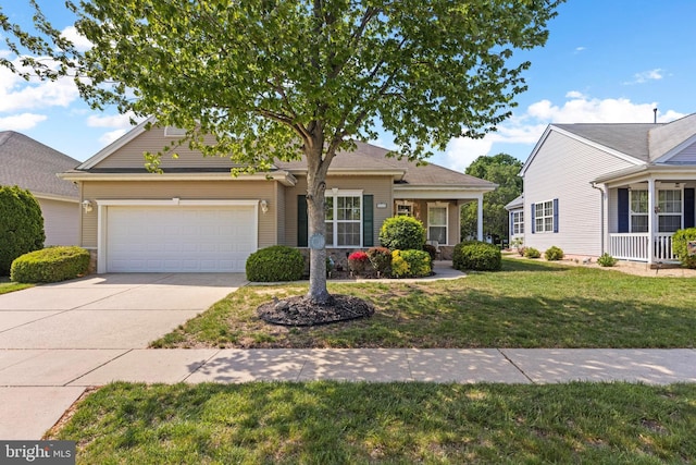 view of front of house featuring a garage, driveway, and a front lawn