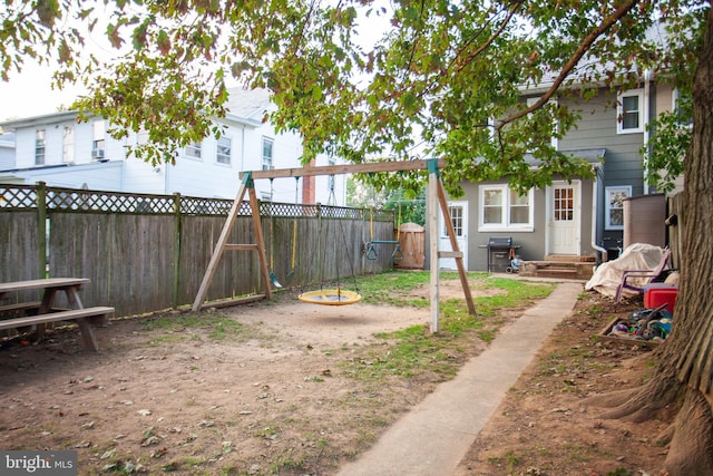 view of yard with entry steps and a fenced backyard