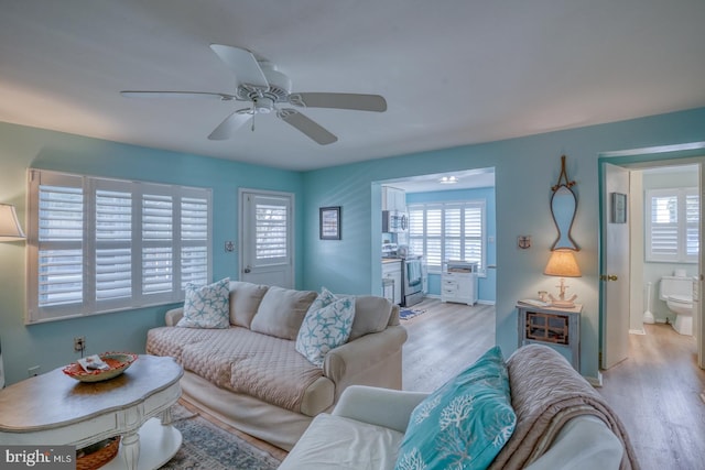 2 E Atlantic St Unit 1, Fenwick Island, DE 19944 - living room with light wood finished floors and ceiling fan