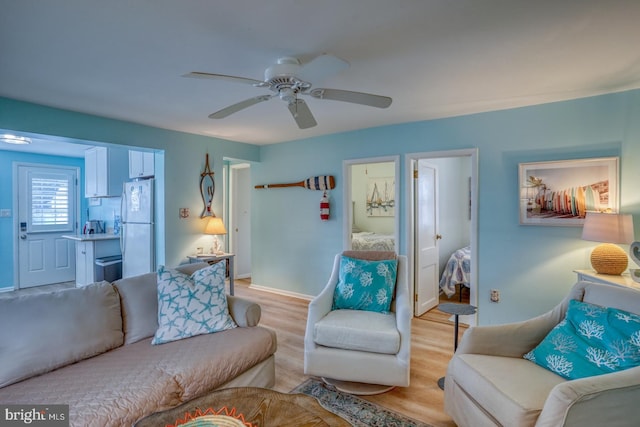 2 E Atlantic St Unit 1, Fenwick Island, DE 19944 - living area with light wood finished floors, a ceiling fan, and baseboards