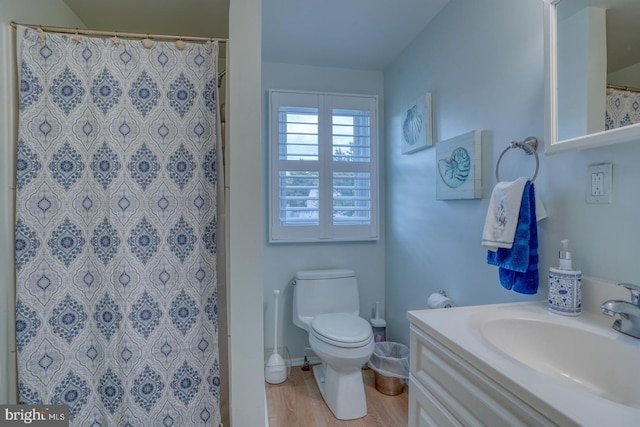 2 E Atlantic St Unit 1, Fenwick Island, DE 19944 - full bath featuring toilet, wood finished floors, vanity, and a shower with shower curtain