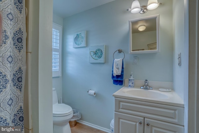2 E Atlantic St Unit 1, Fenwick Island, DE 19944 - bathroom featuring toilet, vanity, baseboards, and a shower with curtain
