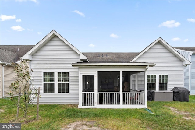 176 Bobbys Branch Rd Unit 56, Millsboro, DE 19966 - rear view of property with a sunroom, a shingled roof, and a yard