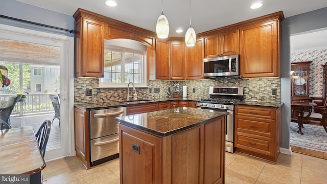 2707 Maynard Rd, Crofton, MD 21114 - kitchen featuring stainless steel appliances, a sink, brown cabinets, dark stone counters, and recessed lighting