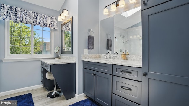 2707 Maynard Rd, Crofton, MD 21114 - bathroom with a stall shower, wood finished floors, baseboards, and vanity