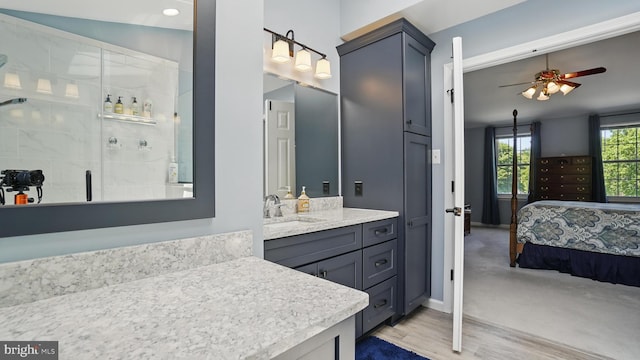 2707 Maynard Rd, Crofton, MD 21114 - full bath featuring a ceiling fan, a shower stall, connected bathroom, vanity, and baseboards