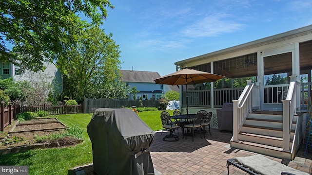 2707 Maynard Rd, Crofton, MD 21114 - view of patio / terrace featuring a vegetable garden, outdoor dining space, grilling area, and a sunroom
