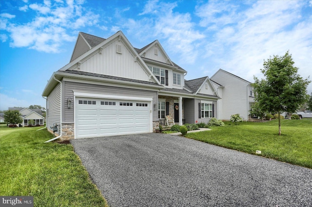 44 Danbury Dr, Mechanicsburg, PA 17050 - view of front of home with board and batten siding, stone siding, driveway, and a front yard