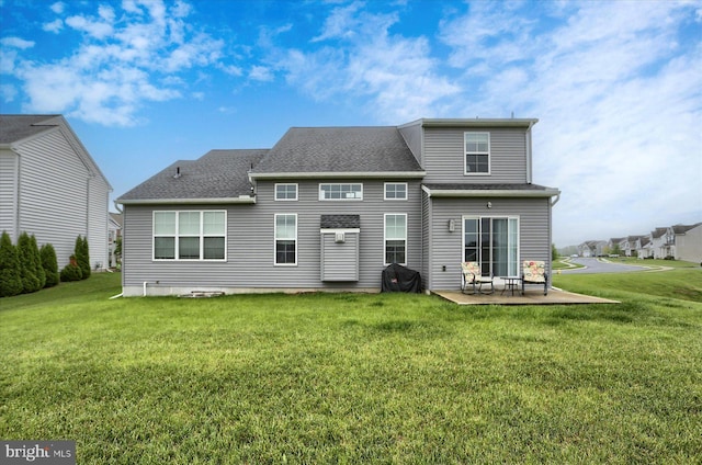 44 Danbury Dr, Mechanicsburg, PA 17050 - rear view of house featuring a patio, a lawn, and roof with shingles