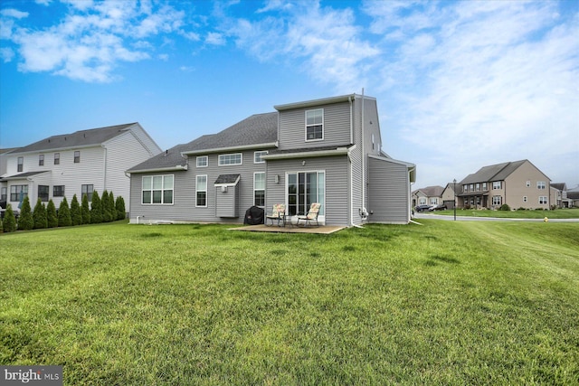 44 Danbury Dr, Mechanicsburg, PA 17050 - rear view of property featuring a patio area, a lawn, a residential view, and roof with shingles