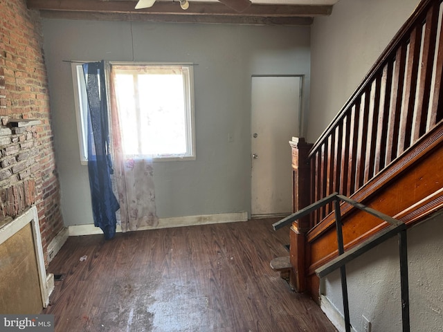 foyer entrance featuring stairs, baseboards, a ceiling fan, and wood finished floors