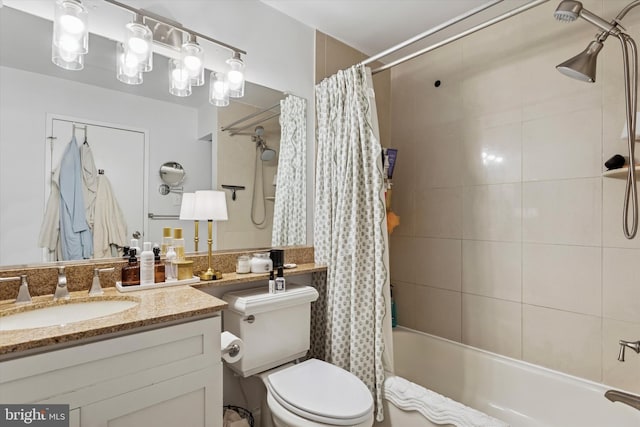 bathroom featuring toilet, shower / bath combo, and vanity