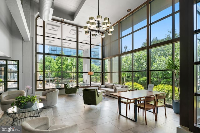 community lobby featuring a towering ceiling and expansive windows