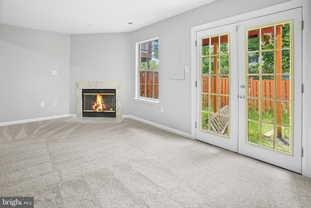 3104 Dynasty Dr, District Heights, MD 20747 - unfurnished living room with a fireplace, baseboards, carpet floors, and french doors