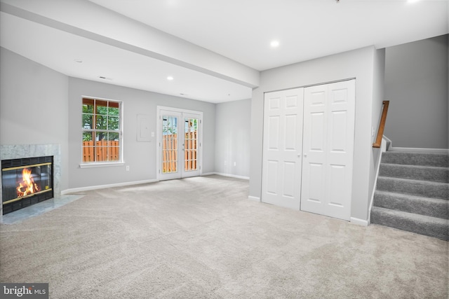 3104 Dynasty Dr, District Heights, MD 20747 - unfurnished living room featuring carpet, baseboards, a high end fireplace, recessed lighting, and stairway