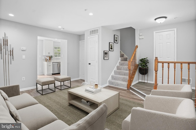 3104 Dynasty Dr, District Heights, MD 20747 - living room featuring light wood finished floors, stairs, recessed lighting, and baseboards