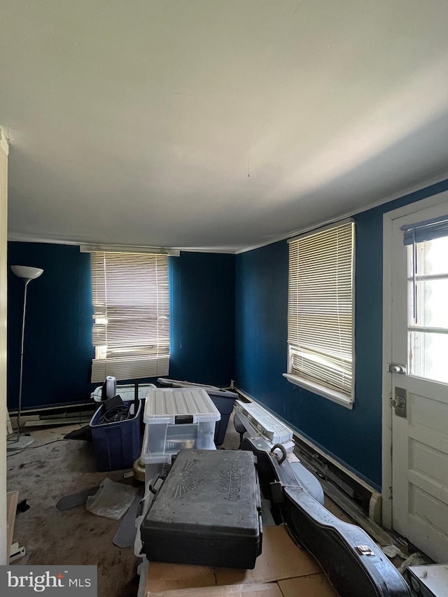 living area featuring crown molding