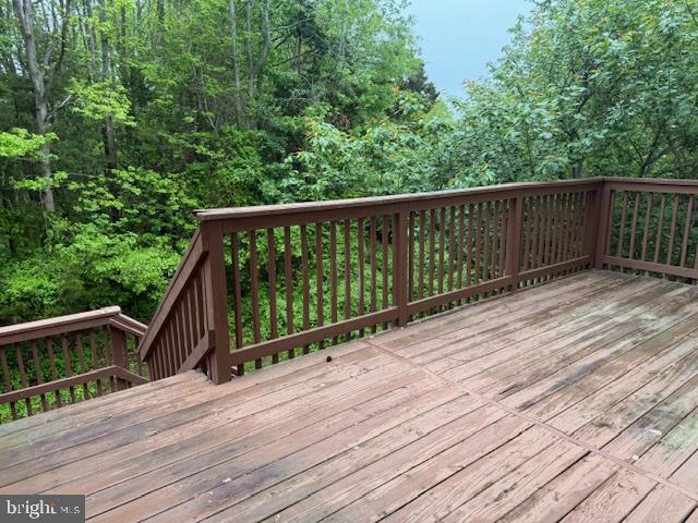 wooden terrace with a forest view