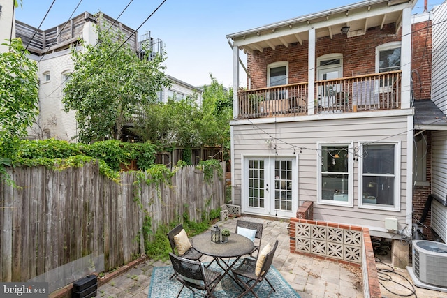 1326 Otis Pl NW, Washington, DC 20010 - fenced backyard with french doors, a patio, central AC unit, and a balcony