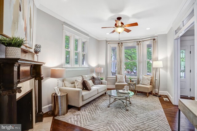 1326 Otis Pl NW, Washington, DC 20010 - living room featuring ceiling fan, crown molding, baseboards, and wood finished floors