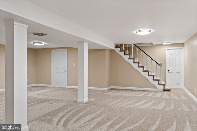 finished basement with carpet floors, baseboards, and stairs