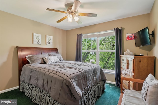carpeted bedroom with baseboards, multiple windows, and ceiling fan
