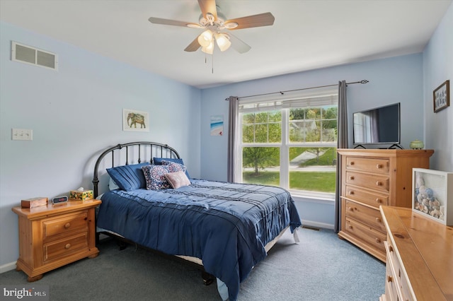 bedroom with carpet floors, baseboards, and a ceiling fan