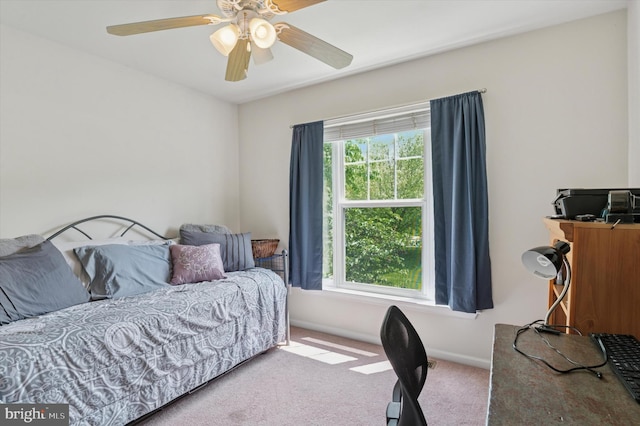 bedroom featuring carpet floors, a ceiling fan, and baseboards