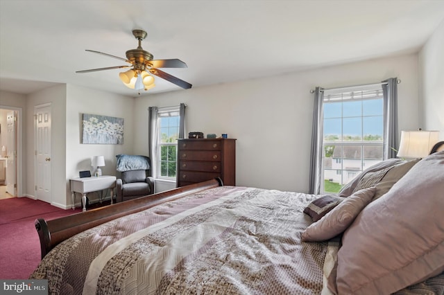 carpeted bedroom featuring ceiling fan and baseboards