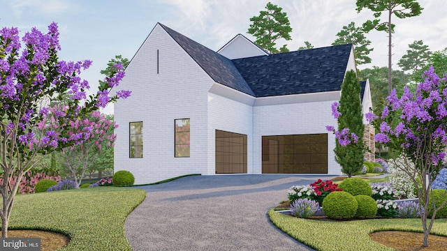 contemporary home with driveway, roof with shingles, and brick siding