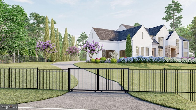 view of gate with a yard and fence
