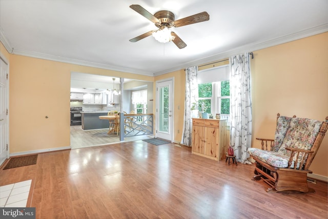 2158 Sebastian Rd, Fredericksburg, VA 22405 - foyer featuring ornamental molding, a ceiling fan, light wood-type flooring, and baseboards