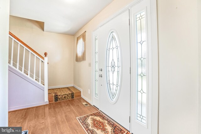 2158 Sebastian Rd, Fredericksburg, VA 22405 - foyer with wood finished floors, baseboards, and stairway