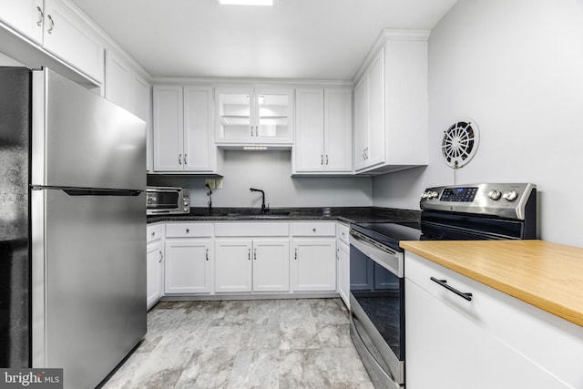 1417 Glendale Rd, Baltimore, MD 21239 - kitchen featuring appliances with stainless steel finishes, a sink, and white cabinets