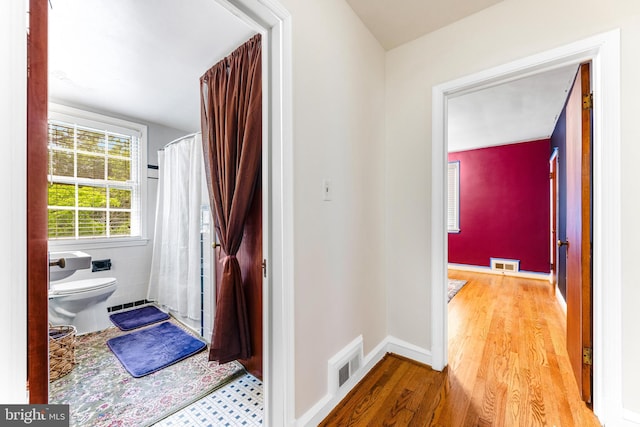 1417 Glendale Rd, Baltimore, MD 21239 - bathroom with toilet, wood finished floors, and a shower with curtain