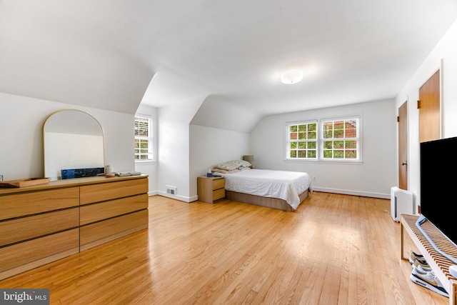 1417 Glendale Rd, Baltimore, MD 21239 - bedroom with light wood finished floors, vaulted ceiling, and baseboards