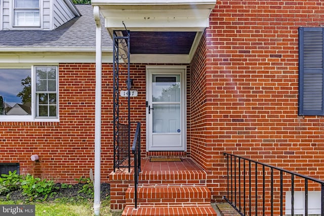 1417 Glendale Rd, Baltimore, MD 21239 - doorway to property featuring brick siding and roof with shingles