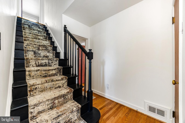 1417 Glendale Rd, Baltimore, MD 21239 - staircase featuring wood finished floors and baseboards