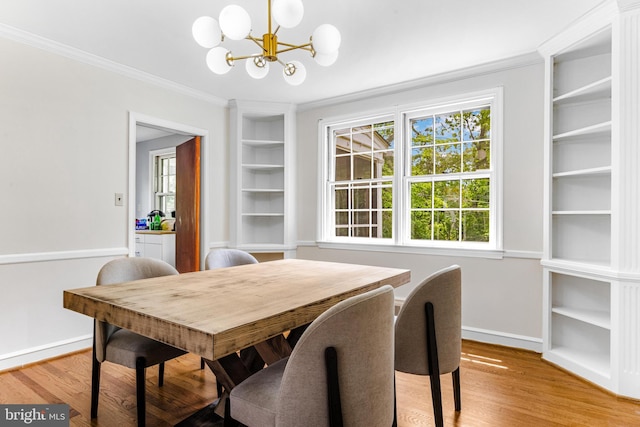 1417 Glendale Rd, Baltimore, MD 21239 - dining area with a chandelier, ornamental molding, light wood-style floors, and baseboards