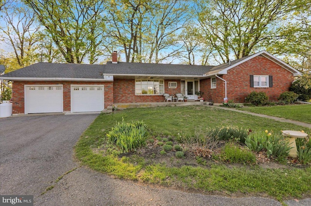70 Miller Rd, Kutztown, PA 19530 - single story home featuring brick siding, an attached garage, a front lawn, and a chimney