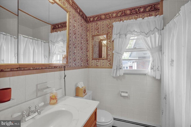 70 Miller Rd, Kutztown, PA 19530 - bathroom with toilet, tile walls, a wainscoted wall, baseboard heating, and wallpapered walls
