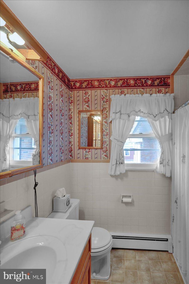 70 Miller Rd, Kutztown, PA 19530 - bathroom with toilet, tile walls, a baseboard heating unit, vanity, and tile patterned floors