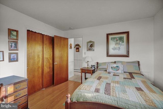 70 Miller Rd, Kutztown, PA 19530 - bedroom with a closet, wood finished floors, and a baseboard radiator