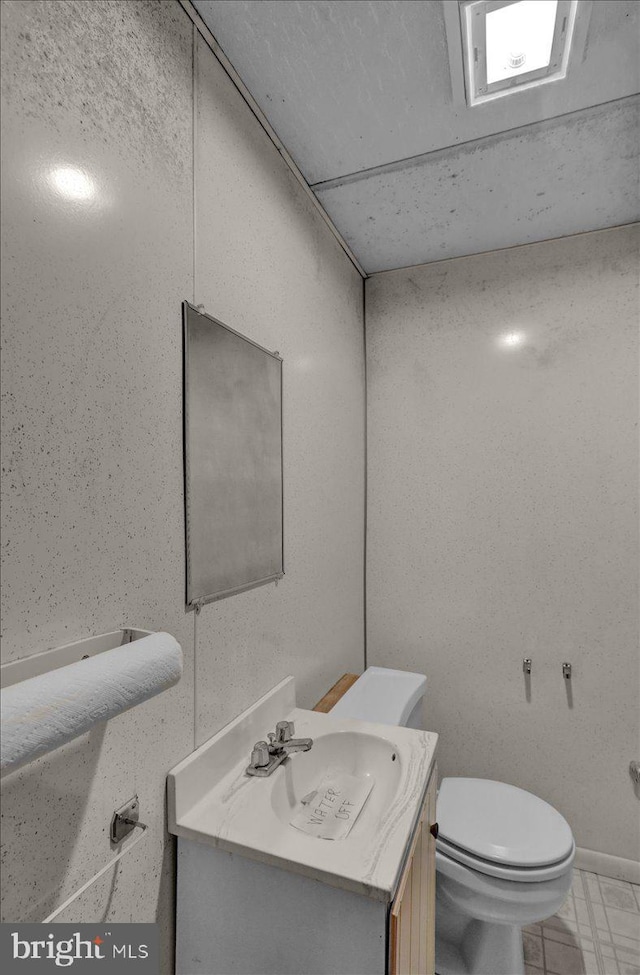 70 Miller Rd, Kutztown, PA 19530 - half bathroom with vanity, toilet, and baseboards