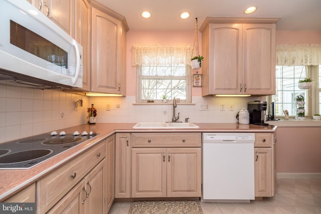 2921 Toll Gate Dr, East Norriton, PA 19403 - kitchen featuring white appliances, a sink, light brown cabinetry, plenty of natural light, and recessed lighting