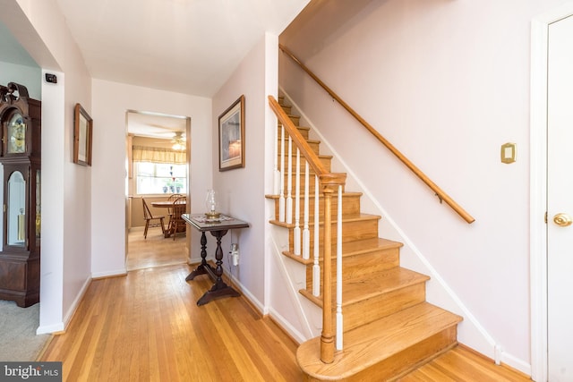2921 Toll Gate Dr, East Norriton, PA 19403 - foyer entrance featuring stairs, baseboards, light wood finished floors, and a ceiling fan