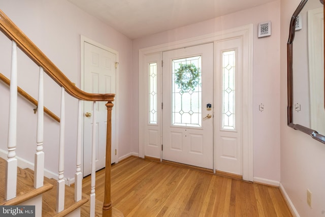 2921 Toll Gate Dr, East Norriton, PA 19403 - foyer with stairway, light wood-style floors, and baseboards