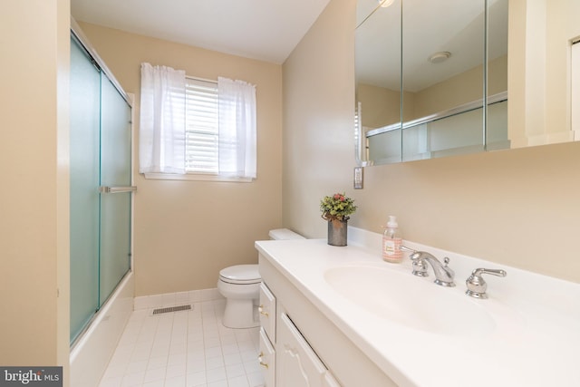 2921 Toll Gate Dr, East Norriton, PA 19403 - full bath featuring toilet, tile patterned floors, vanity, combined bath / shower with glass door, and baseboards